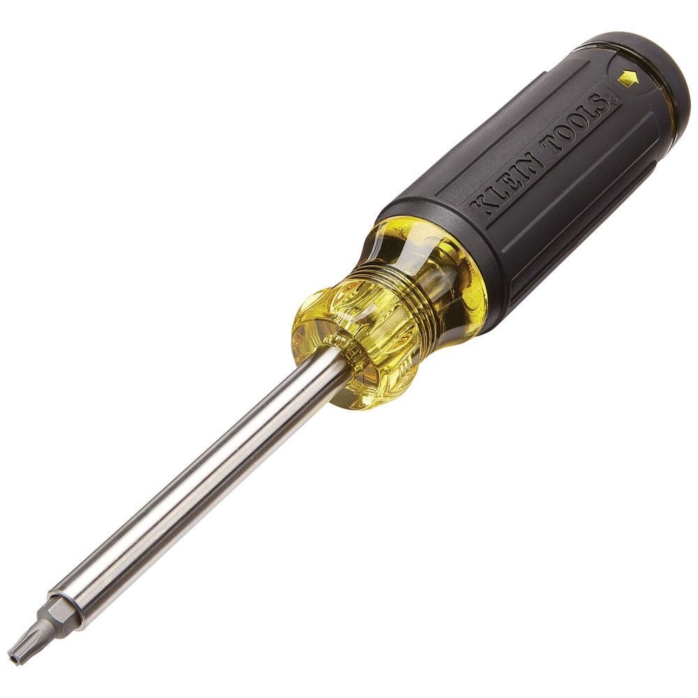 A Klein Tools multi-bit screwdriver with a black and yellow handle, a stainless barrel and a tamperproof bit fitted